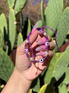 Evil Eye 🧿 Beaded Bracelet In many cultures, it is believed that evil eye bracelets protect against misfortune, evil looks and negative energy. Wear your bracelet for good luck and protection. ✨ Purple Evil eye boosts your imagination; Re-balances your life and removes obstacles. ✨ Evil Eye Bracelet Purple, Violet Evil Eye Bracelet, Trendy Evil Eye Friendship Bracelets As Gift, Trendy Evil Eye Friendship Bracelets For Gifts, Trendy Evil Eye Bracelet As Gift, Evil Eye Round Beads Friendship Bracelets For Festival, Evil Eye Friendship Bracelets With Round Beads For Festivals, Festival Evil Eye Friendship Bracelets With Round Beads, Trendy Evil Eye Beaded Bracelets For Festivals