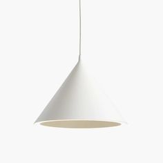 a white light hanging from a ceiling in the shape of a cone with a long cord