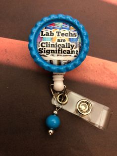 "Retractable badge reel with design \"Lab Techs are Clinically Significant\". Your choice of Alligator clip back or belt clip back. Matching glass bead dangle is included but can be omitted by request. Perfect for Lab Week!" Adjustable Badge Reel With Key Clip As Gift, Adjustable Badge Reel With Key Clip Gift, Lab Week Gifts, Med Lab, Medical Laboratory Scientist, Lab Week, Medical Laboratory Science, Lab Tech, Medical Laboratory