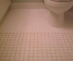 a white toilet sitting in a bathroom next to a bath tub