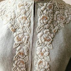 a close up of a dress on a mannequin headdress with beading