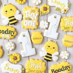 decorated cookies are arranged in the shape of numbers and bees for first day of school