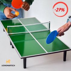 two people are playing ping pong on the table