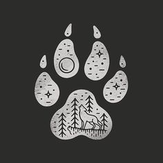 an animal's paw print with trees and stars