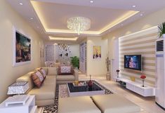 a living room filled with furniture and a flat screen tv mounted on the wall above a fire place