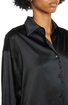 Lustrous silk enhanced with stretch lends beautiful drape to this relaxed-fit blouse detailed with glossy mother-of-pearl buttons and a curved hem. 34 1/2" length (size 48) Front button closure Point collar Long sleeves with button cuffs Curved hem 94% silk, 6% elastane Dry clean Made in Italy Women's Designer Clothing Black Satin Shirt, Satin Shirts, Blouse Nordstrom, Fitted Blouses, Satin Shirt, Satin Blouse, Silk Shirt, Designer Outfits Woman, Black Satin