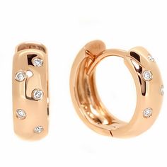 Delicately designed, these high-polished hoop huggie earrings are set with dazzling white diamonds. The earrings are made of solid 14k rose gold and weigh 4.5 grams. The hoops measure 15.5mm x 5.8mm. Luxury Channel Set Round Cut Huggie Earrings, Luxury Huggie Earrings With Prong Setting, Luxury Yellow Gold Hinged Huggie Earrings, Rose Gold Huggie Hoop Earrings For Anniversary, Rose Gold Vvs Clarity Huggie Diamond Earrings, Formal Rose Gold Huggie Earrings With Polished Finish, Anniversary Rose Gold Small Hoop Huggie Earrings, Anniversary Small Hoop Rose Gold Huggie Earrings, Rose Gold Diamond Huggie Earrings