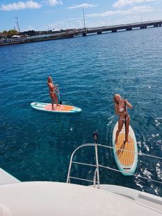 two people on paddle boards in the water