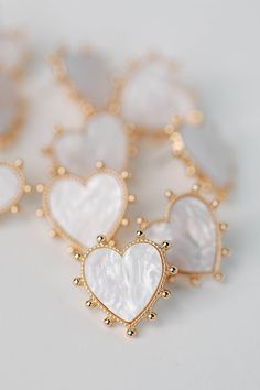 Elevate your Valentines Day style with our newest heart design! At slightly under 1" in length, these chunky gold earrings feature faux pink mother of pearl outlines in trendy gold-toned studs. Valentines Day Style, Chunky Gold Earrings, Marco Island, New Heart, Gold Studs, Heart Earrings, Heart Design, Jewelry Earrings Studs, Tortoise