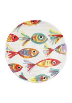 a plate with colorful fish painted on the front and back of it's surface