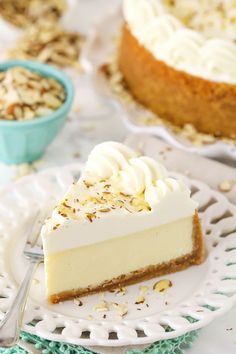 a slice of cheesecake on a plate with a fork and bowl in the background