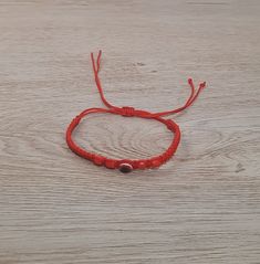 This gorgeous evil eye bracelet will ward off negative energy and bad luck! Handcrafted with care and soft cord by Ecuadorian artisans, it adjusts from 4" to 7.5" and fits any and all ages! Choose from striking red and black colors.