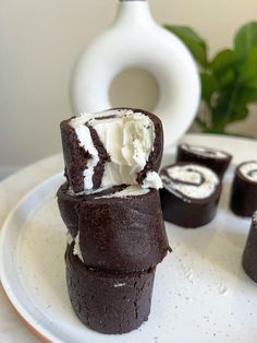 chocolate cupcakes with white frosting on a plate