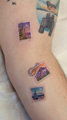 a person with tattoos on their arm and some pictures