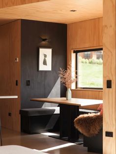 a room with wood paneling and black walls