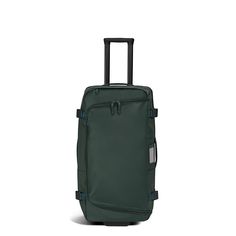 The Outdoor Rolling Duffle 85L features a soft packable front duffle, a lightweight polycarbonate back shell, oversized wheels, and added pockets for storage. This checked bag is made from recycled, water- and abrasion-resistant materials and is designed to protect your belongings from the elements. Functional Green Luggage For Trip, Green Nylon Luggage With Sleeve, Green Nylon Luggage With Luggage Sleeve, Green Rectangular Nylon Luggage, Green Nylon Functional Luggage, Functional Green Nylon Luggage, Waterproof Nylon Luggage For Trips, Rolling Duffle Bag, Flight Essentials