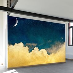 an empty room with a large painting on the wall and clouds in the sky above