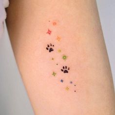 small paw prints on the left side of the right arm, with stars and dog's footprints