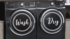 two washers sitting side by side in a kitchen