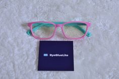 Pink/Cyan frame color children's blue light blocking glasses by ByeBlueLite! Non-prescription lenses that provide anti-UV400 of which greatly reduces eyestrain, headaches as well as improved sleeping conditions. Harmful blue rays have been proven to cause such issues, and ByeBlueLite glasses specifically block them. Children's eyes tend to be more sensitive to screen time then adults, and with the increased screen time children use these are very helpful! These glasses are made from very flexibl Cyan Color, Cyan Colour, Blue Light Glasses, Blue Ray, Eye Wear Glasses, Screen Time, Prescription Lenses, Eyewear Sunglasses, Blue Light