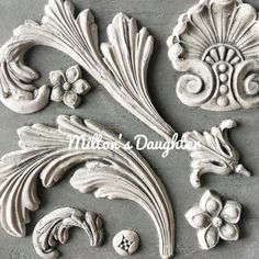 an image of decorative plaster molds for home decor or wall hangings on the walls