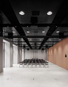 an empty room with rows of chairs in it