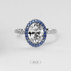 an oval diamond and blue sapphire ring