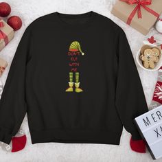 🎅 Get Cozy and Festive with Our Merry Christmas Sweatshirts! 🎄 'Tis the season to be jolly, and we've got just the collection to make your Christmas merrier than ever. Explore our Merry Christmas sweatshirts, where comfort meets holiday cheer in style! 🎅 Merry Christmas Everyone: Festive Christmas Sweatshirts Embrace the spirit of the season with our Merry Christmas sweatshirts. Spread joy, warmth, and goodwill with every wear. ☃️ Winter Wonderland Wardrobe: Christmas Shirts for a Chilly Seas Funny Long Sleeve Christmas T-shirt, Festive Winter Shirt With Letter Print, Funny Crew Neck Tops For Winter, Black Crew Neck Shirt For Christmas, Funny Long Sleeve Christmas Tops, Winter Funny Print Crew Neck Top, Winter Crew Neck Top With Funny Print, Gift Black Long Sleeve Shirt, Funny Christmas Crew Neck Top