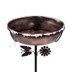 a metal and wood bowl on a stand