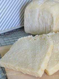 slices of bread sitting on top of a wooden cutting board