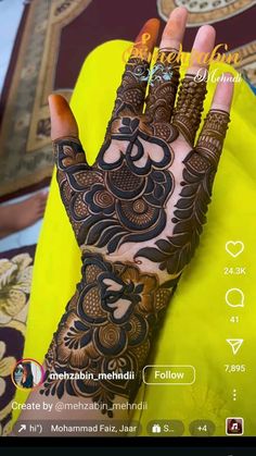 the hand is decorated with henna and flowers on it's fingers, which are also