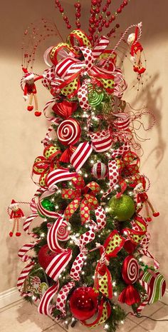 a christmas tree decorated with candy canes and ornaments