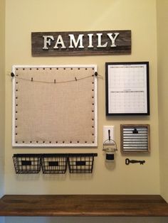 a family bulletin board is hanging on the wall above a shelf with baskets and other items