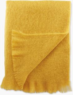 a yellow blanket folded on top of each other