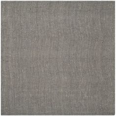 a gray rug with an uneven design