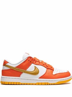 Orange/white leather Dunk Low “University Gold” sneakers from NIKE featuring signature Swoosh logo detail, embroidered logo to the rear, contrasting panel detail, round toe, front lace-up fastening, logo patch at the tongue, branded insole and rubber sole. These styles are supplied by a premium sneaker marketplace. Stocking only the most sought-after footwear, they source and curate some of the most hard to find sneakers from around the world.. Dunk Orange, Golden Sneakers, Nike Dunk Lows, Orange Sneakers, Athletic Clothes, Gold Sneakers, Diy Fashion Clothing, Fresh Shoes, Nike Dunk High