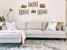 a living room filled with furniture and pictures on the wall above it's couch