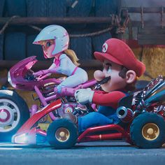 mario kart and princess peach on a pink motorcycle