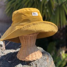 "A yellow wide brim corduroy sun hat for beach days and sunny day fun.  This sun hat for women has a nice wide brim to protect your whole face and even your neck and chest.  Easy to bring along in your bag, folds up easy.   This hat is made from a mustard yellow cotton corduroy fabric.  Inside liner is white cotton.  I used interfacing inside the brim to keep it's shape. Brim measures 4.5\" Crown depth is 3.5\". Contact me for custom fit option. SIZES AVAILABLE S - measures 22.5\" (fits heads wi Cheap Fun Yellow Bucket Hat, Cute Yellow Bucket Hat, Large Brimmed Hats, Cheap Yellow Festival Hat, Yellow Cotton Hat For Outdoor, Yellow Cotton Outdoor Hat, Yellow Bucket Hat For Spring Outdoor, Yellow Outdoor Hat For Spring, Yellow Casual Sun Hat With Uv Protection