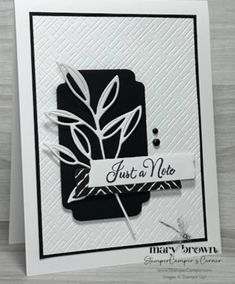 a card that says just a note with a black and white design on the front