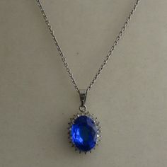 Man Made Sapphire Pendent With Chain Nwot Has Never Been Worn Beautiful Necklace Chain Is Sterling Silver And Measures 18" Even Tho It Is Man Made In A Lab, It Has Plenty Of Sparkle Feel Free To Make An Offer Or Ask A Question!!! Elegant Blue Chain Necklace For Party, Blue Round Pendant Chain Jewelry, Blue Round Pendant Jewelry With Chain, Blue Jewelry With Chain And Round Pendant, Blue Jewelry With Round Pendant Chain, Blue Silver Chain Necklace As Gift, Formal Blue Metal Necklace, Elegant Blue Metal Chain Necklace, Elegant Blue Clavicle Chain Necklace