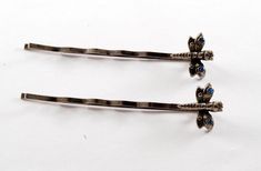 "For sale is a pair of vintage hair pins. These hair pins are silver tone metal with blue rhinestone fire fly ends.  A beautiful design to compliment that special hair style. The bobby pins measure 2\" long.  Please note there could be blemishes in the finish. New treasures added all the time. Check back often!" Bobby Pins Aesthetic, Cute Barrettes, Vintage Hair Pin, Vintage Hairpin, Vintage Hair Pins, Decorative Bobby Pins, Metal Hair Clips Vintage, Silver Bobby Pins, Vintage Barrettes