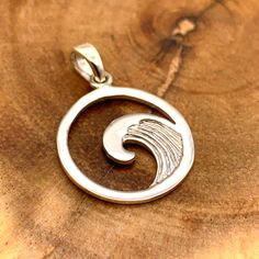 Our rendition of a chaotic tsunami placed neatly on a 925 sterling silver pendant. Sterling Silver Wavy Necklace For Gifts, Spiral-shaped Engraved Sterling Silver Jewelry, Engraved Sterling Silver Spiral Jewelry, Silver Wavy Necklace For Gift, Artistic Sterling Silver Necklace With Polished Finish, Artistic Silver Jewelry With Charms, Cadmium-free Sterling Silver Round Pendant Jewelry, Cadmium-free Sterling Silver Round Pendant, Artistic Silver Necklaces With Polished Finish