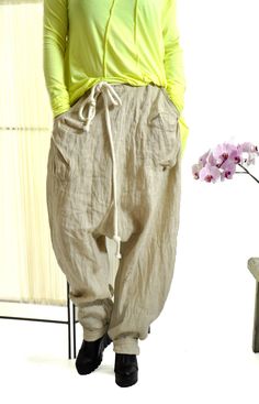 "Harem Pants Linen, Women Linen Pants, Beige Pants ☆ Woman summer pants ☆ NEW collection! Beige 100% pants of high quality eco linen. The pants are very comfortable. These pants are both sports and everyday. You can go to work with them, you can also wear them in the free days. Loose fitting. Model wearring size M Color : Natural The style was originally designed and professionally constructed by me. Each item of my shop is specially packaged with a lot of concern! Handmade in a pet-free and smo Vintage Oversized Straight Leg Bottoms, Vintage Oversized Wide Leg Bottoms, Spring Baggy Harem Pants With Pockets, Oversized Beige Pants For Spring, Baggy Wide-leg Linen Cargo Pants, Baggy Wide Leg Linen Cargo Pants, Baggy Beige Wide Leg Parachute Pants, Baggy Wide Leg Beige Parachute Pants, Spring Oversized Pants With Pockets