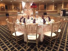 a large banquet table set up with white linens