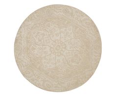 a round rug with an intricate design on the top and bottom, in beige tones