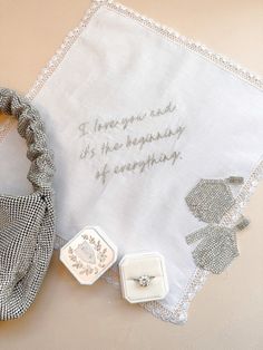 Our Embroidered Hankies are a timeless and elegant accessory that blends classic craftsmanship with literary inspiration. Carefully hand-embroidered and crafted from premium white cotton, with sparkling silver embroidery, this handkerchief is more than just a beautiful accessory—it's a piece of art that captures the essence of sophistication. The hand-embroidered detailing adds a touch of vintage charm, making it the perfect companion for any occasion, whether it's a special event, like a weddin Embroidered Hankies, Wedding Ring Boxes, Heirloom Ring, The Beginning Of Everything, Wedding Hankies, Engagement And Wedding Ring, Silver Embroidery, Ring Boxes, Wedding Ring Box