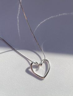 925 Sterling Silver Gold Plating,  Love Bound Heart necklace, love necklace, couple necklace, loop necklace with heart shaped The silver accents on the pendant add a subtle contrast and enhance the overall aesthetic appeal. The dainty design of the necklace makes it versatile, suitable for both casual and formal occasions. It's an exquisite piece that can be worn alone or layered with other necklaces for a personalized look. This necklace also makes a thoughtful Birthday gift for a special person in your life. It's a timeless piece of jewelry that will be treasured for years to come. Features: * Material: 925 Sterling Silver Gold and Rhodium Plating * Lenth: 50 cm / 19,6 inch * Shape: Heart * Comes in Special Gift Box - Kindly provide your telephone number at checkout for delivery purposes Love Necklace Couple, Necklace Couple, Loop Necklace, Necklace With Heart, Couple Necklace, Necklace Love, Couple Necklaces, Love Necklace, Silver Accents