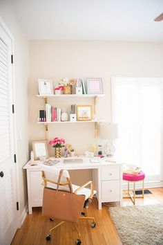 a white desk and chair in a room