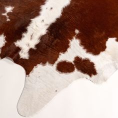 a brown and white spotted cow skin pattern